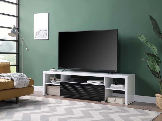 front view of a modern living room with a white tv stand and a tv on top