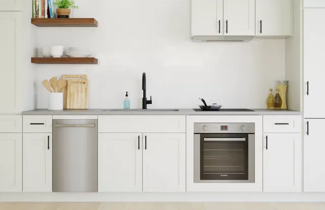 front view of a white kitchen with a bosch dishwasher and range 