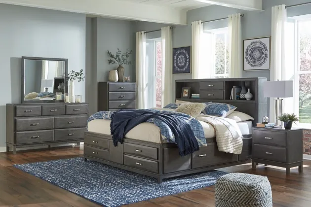 front view of a modern bedroom with a matching bedroom set and a dresser with mirror
