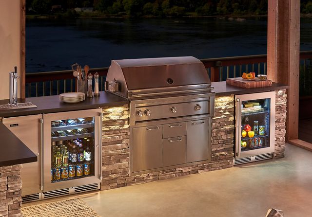 high end patio kitchen with outdoor fridge