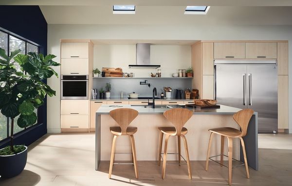 Kitchen featuring Electrolux appliances including oven, refrigerator and range hood