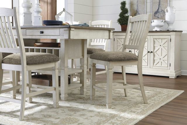 low view of a modern farmhouse dining room with a white storage table, matching chairs, and a matching sideboard