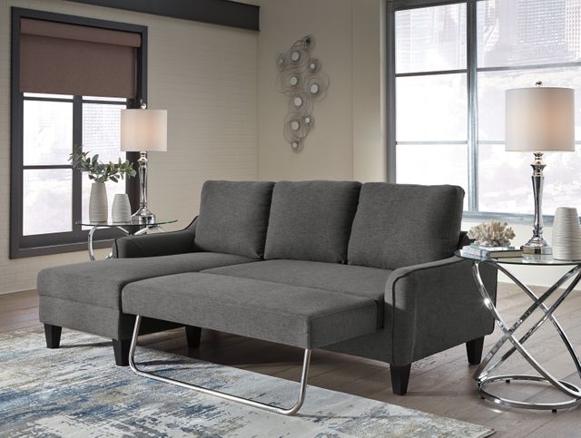front right view of a dark grey sleeper sofa in a contemporary living room