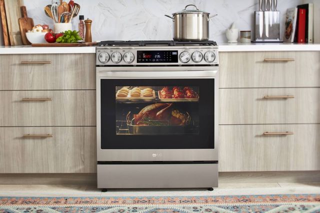 front view of an lg oven cooking food in a modern kitchen