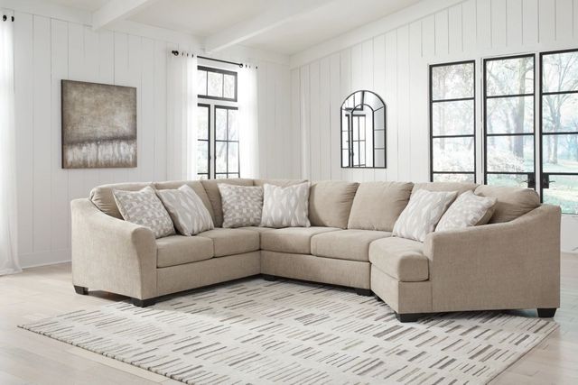 front view of a cream curved sectional in a white modern farmhouse living room