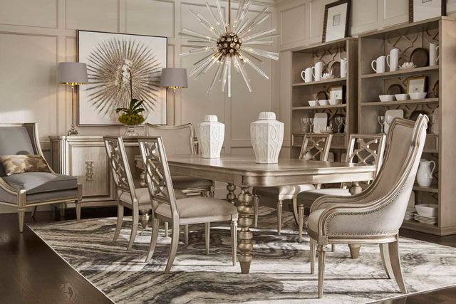 view of a luxury beige dining room with a table, chairs, and accent furniture
