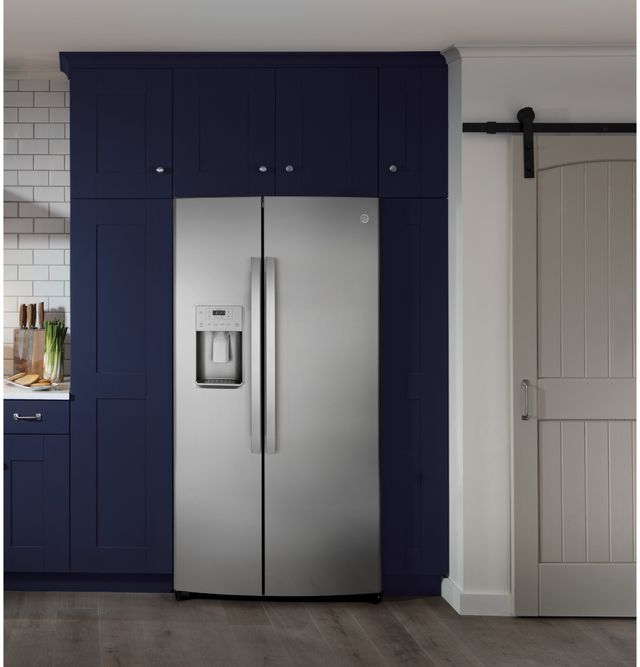 GE side by side refrigerator against a blue wall