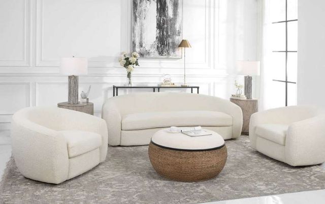 front view of a bright modern bedroom with white contemporary sofa and matching swivel accent chairs