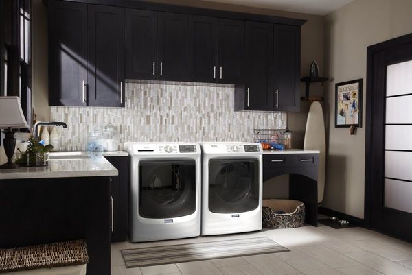 Laundry Room Featuring a Maytag 4.5 Cu. Ft. White Front Load Washer