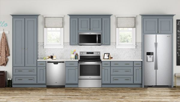 Kitchen Showcasing a Whirlpool 4 Piece Stainless Steel Kitchen Package
