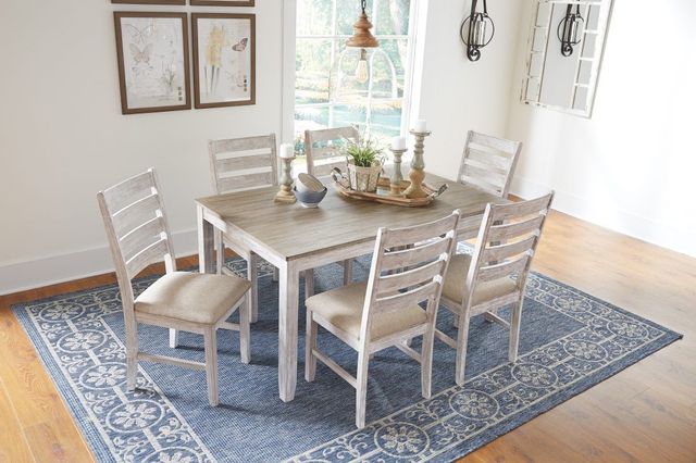 tall standing view of a modern farmhouse dining room set with a rectangular table and six chairs
