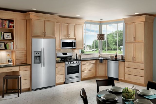 view of a kitchen with light wood and frigidaire appliances throughout