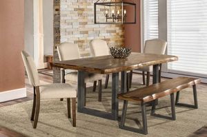 view of the Hillsdale Furniture Emerson 6-Piece Natural Sheesham Dining Set in a modern dining space with brown walls and a stone accent wall