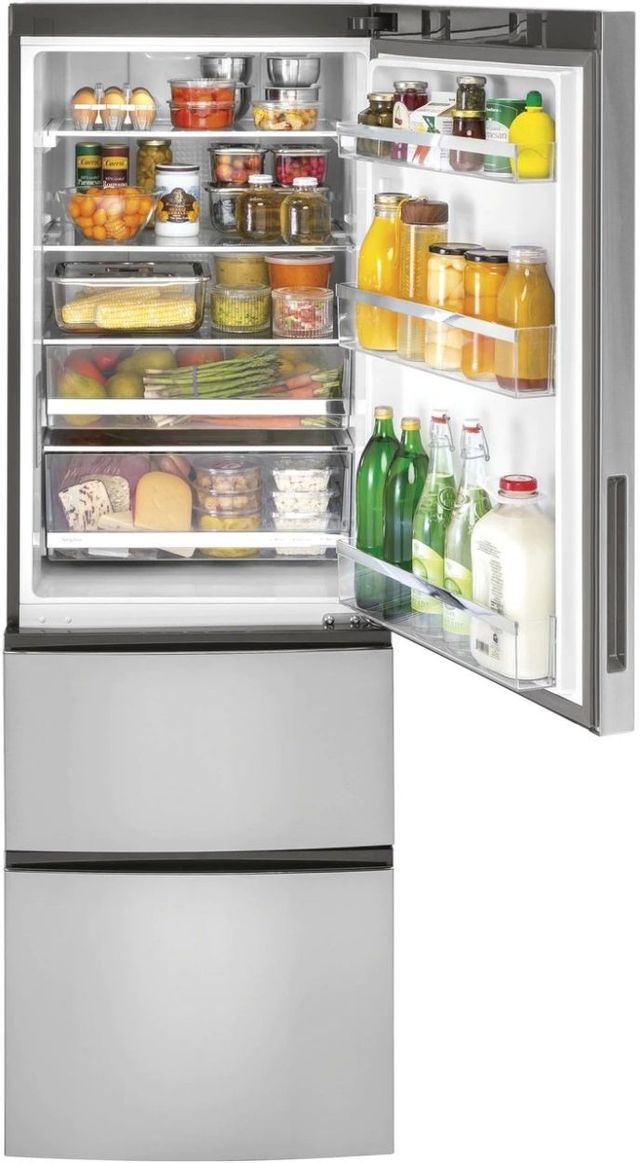 GE bottom freezer refrigerator with open door and food stored inside