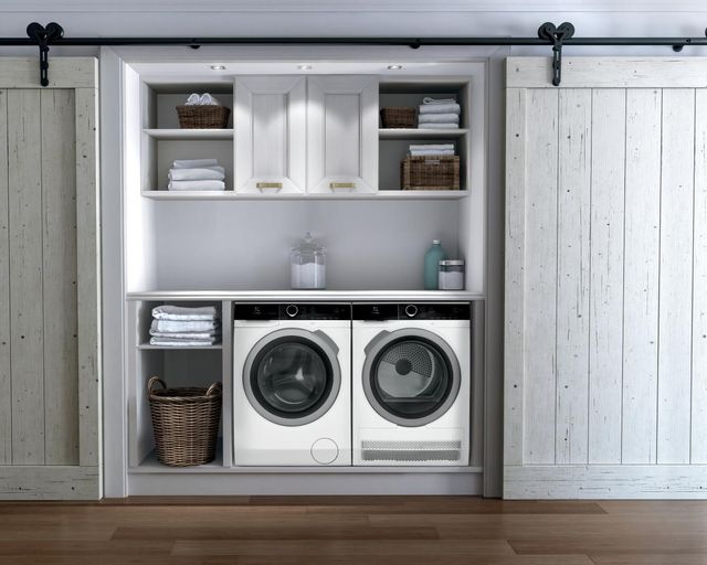 front view of a modern farmhouse laundry closet with white front load washer and dryer