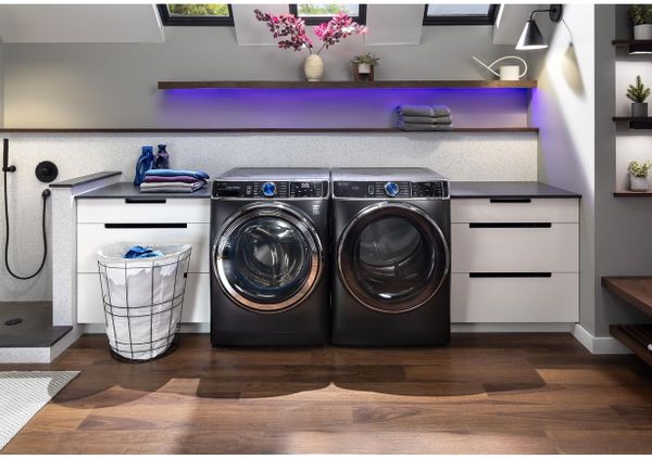 Laundry Room Featuring GE Profile 5.3 Cu. Ft. Carbon Graphite Front Load Washer and Dryer
