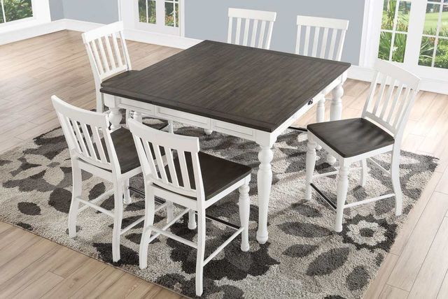white and greige counter height dining table surrounded by matching chairs in