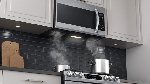 Samsung stainless steel over the range microwave installed above a range