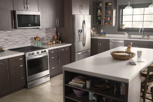 Kitchen featuring Whirlpool appliances, including refrigerator, range and mircrowave