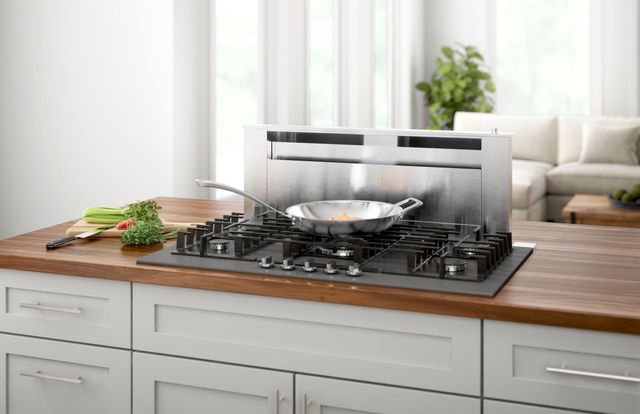 front view of a downdraft rangetop in a modern kitchen island