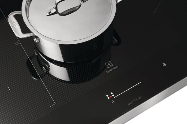 closeup of an Electrolux induction cooktop with a pot on top