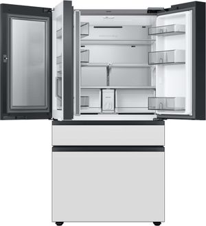 front view of an opened Samsung Bespoke 23 Cu. Ft. Custom Panel Ready/White Glass French Door Refrigerator with Family Hub™