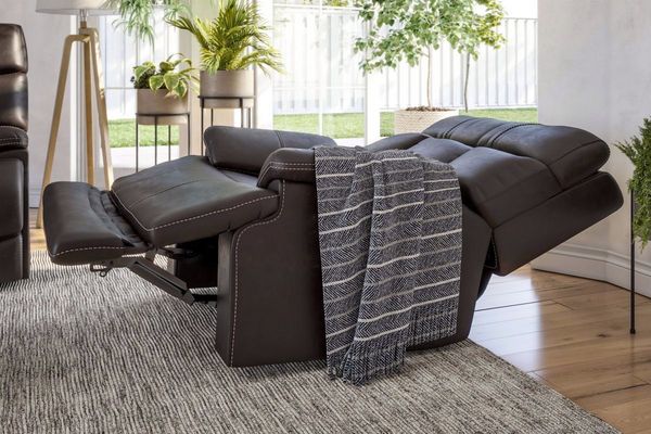 side view of a fully reclined, brown recliner chair