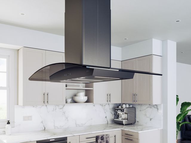 front angled view of the Zephyr Ravenna Island 36" Smoke Gray Glass Island Range Hood in a modern white kitchen