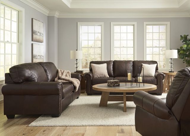 front view of a transitional living room with dark brown leather furniture