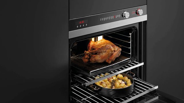Fisher & Paykel oven built in a dark cabinet