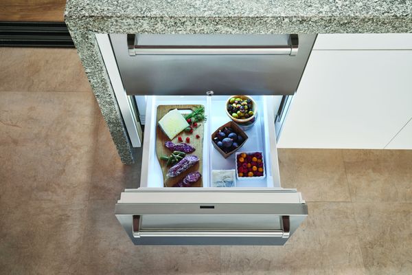 Outdoor Kitchen Featuring a Sub-Zero 24" Panel Ready Outdoor Refrigerator Drawers