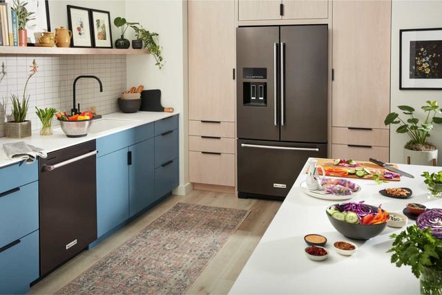 front view of a black stainless kitchenaid french door refrigerator in a modern kitchen