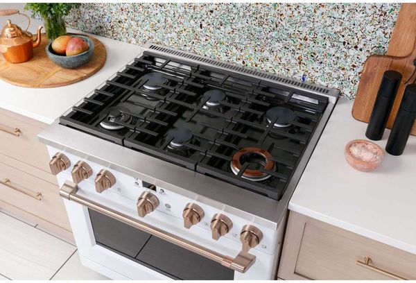Kitchen Showcasing Café 36" Stainless Steel Pro Style Dual Fuel Range