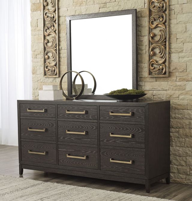 front view of the Burk Dresser and Mirror in a traditional bedroom with a stone wall