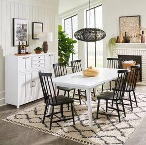 view of the Liberty Capeside Cottage 7-Piece Porcelain White/Royal Black Table Set in a modern dining room with white walls