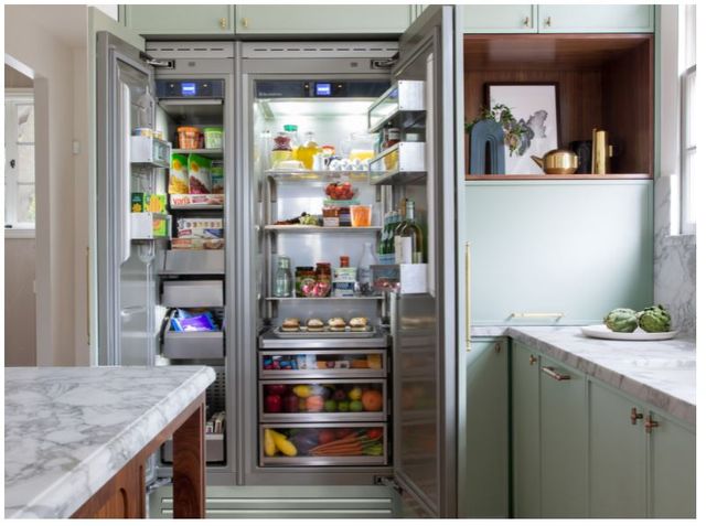 full counter depth refrigerator open in a traditional contemporaty kitchen