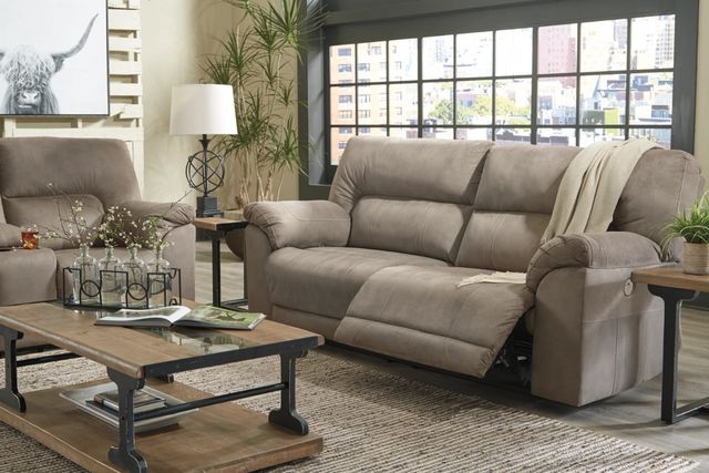 front right view of a modern farmhouse living room with a beige sofa, with one side reclined back
