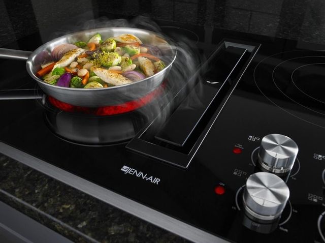 jannair downdraft cooktop ventilating steam from a stir fry in a pan