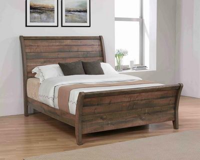 dark wooden sleigh bed