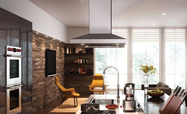 front view of an island range hood in a modern kitchen