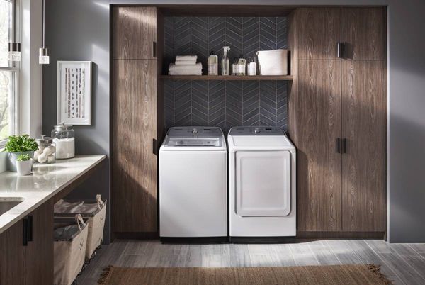 Laundry room featuring a white Samsung washer and dryer
