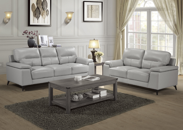 unique-sofa-styles-1 view of a contemporary living room with a light gray leather sofa and matching accent chair