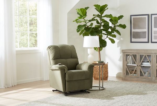 front view of a green glider recliner in a modern living room