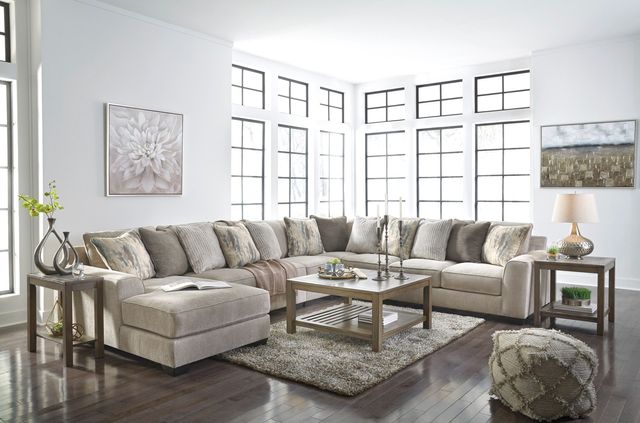 front view of a large sectional couch in a bright white modern living room