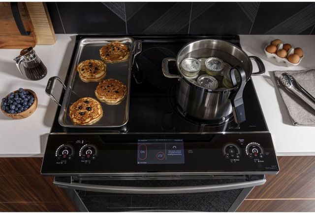 top view of an induction range with breakfast being cooked on top