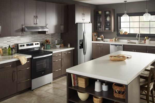 Kitchen showcasing Whirlpool appliances including a fridge, dishwasher and range