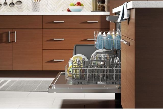 side view of an opened dishwasher with the racks pulled out
