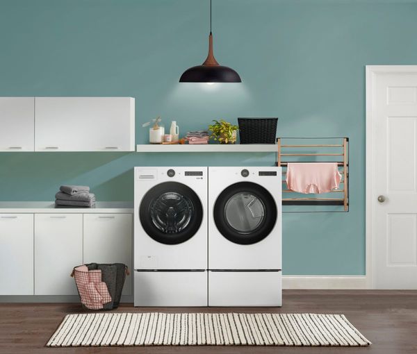 Laundry Room Featuring an LG 7.4 Cu. Ft. White Front Load Electric washer and Dryer
