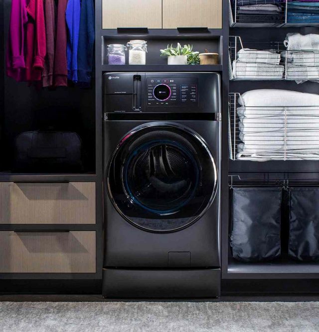 front view of the ge one and one washer dryer combo in a modern laundry room