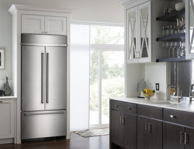 front view of a built in kitchenaid refrigerator in a modern kitchen 